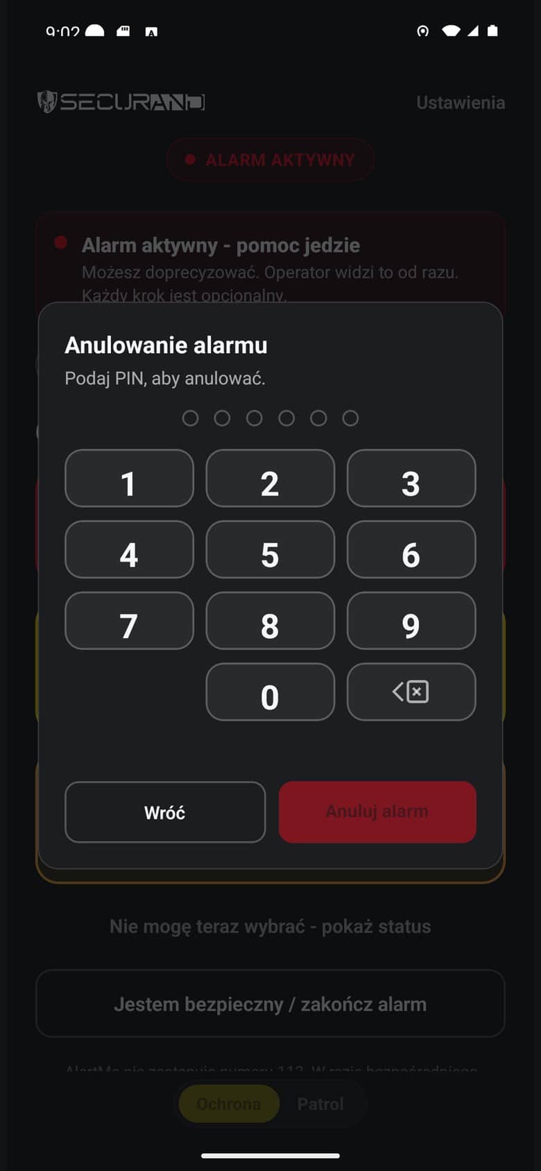 Anulowanie alarmu wymaga PIN-u: klawiatura numeryczna nad przyciemnionym ekranem trwającego zgłoszenia
